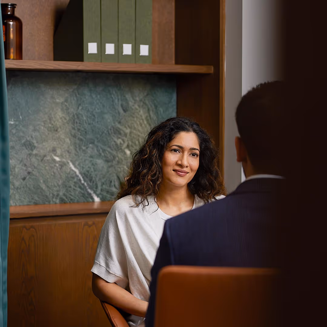 A woman sitting in an office