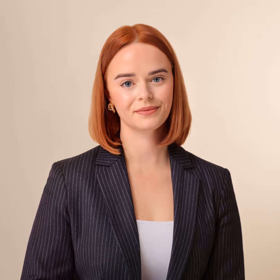 An employee in a striped blazer