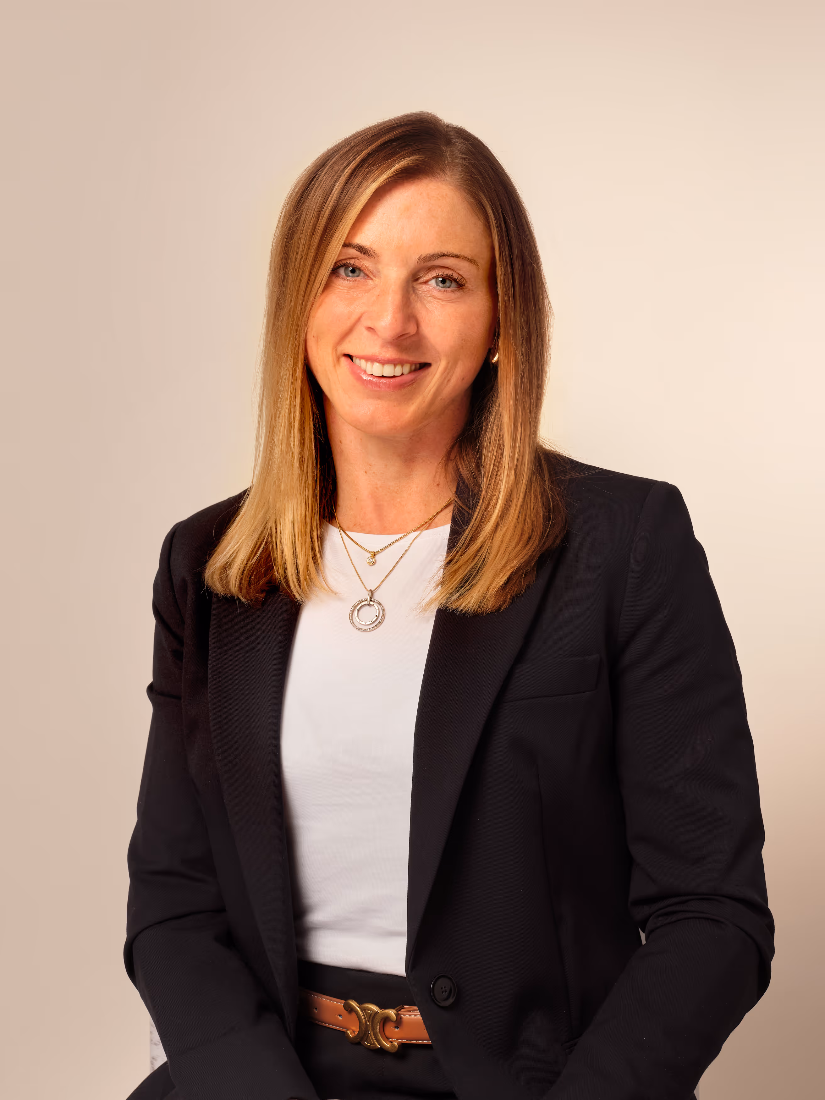 A woman in a black blazer