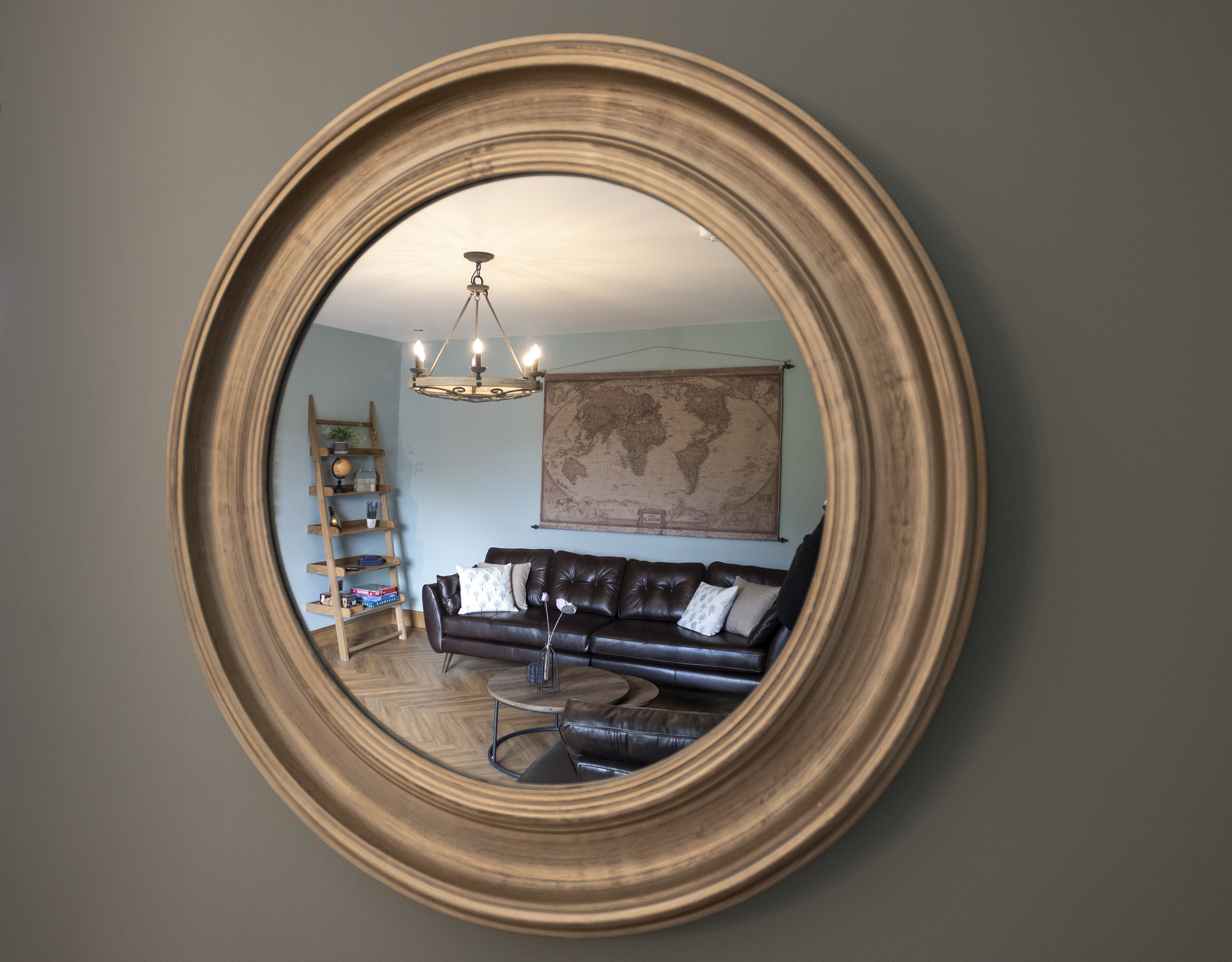 Reflection of the sitting room in a round mirror