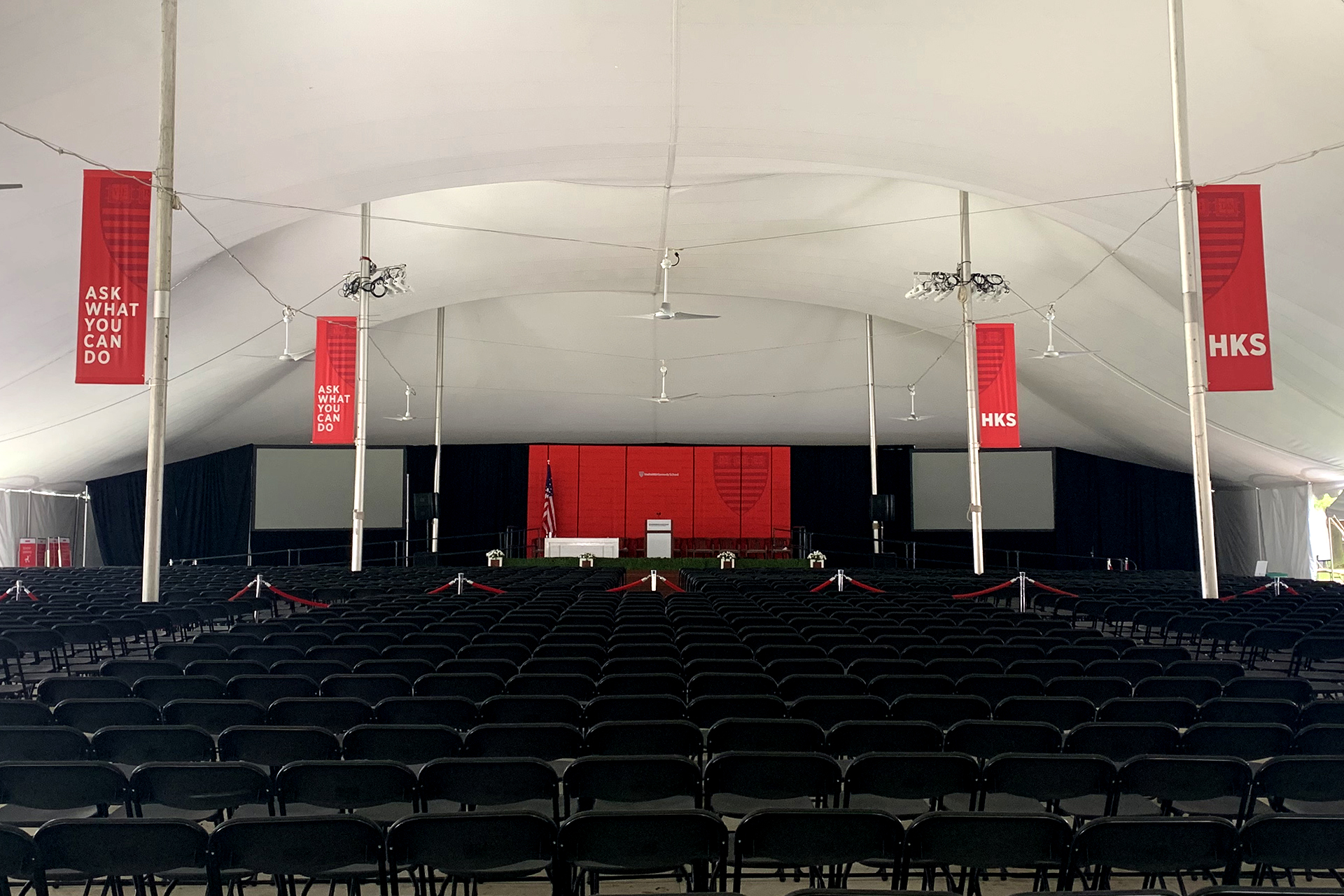 HKS Commencement tent pole banners in foreground with new set appearing in background