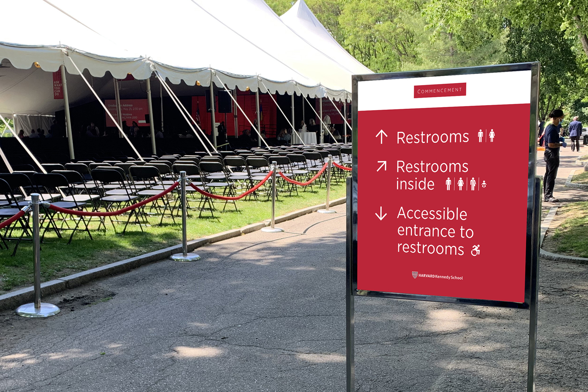 An example of numerous wayfinding signs positioned around campus to welcome and direct guests during HKS Commencement week events