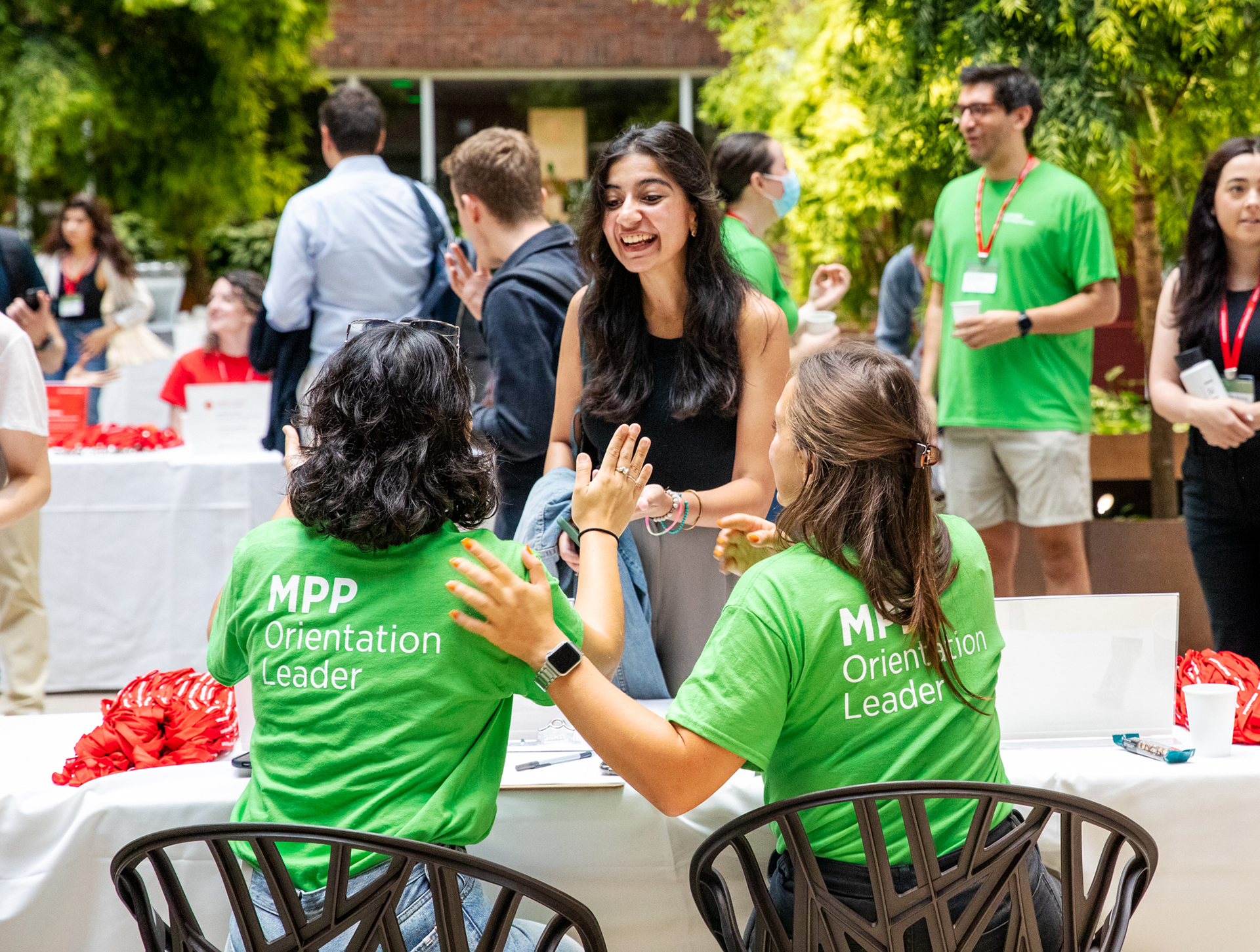 MPP Program staff handing student her name badge