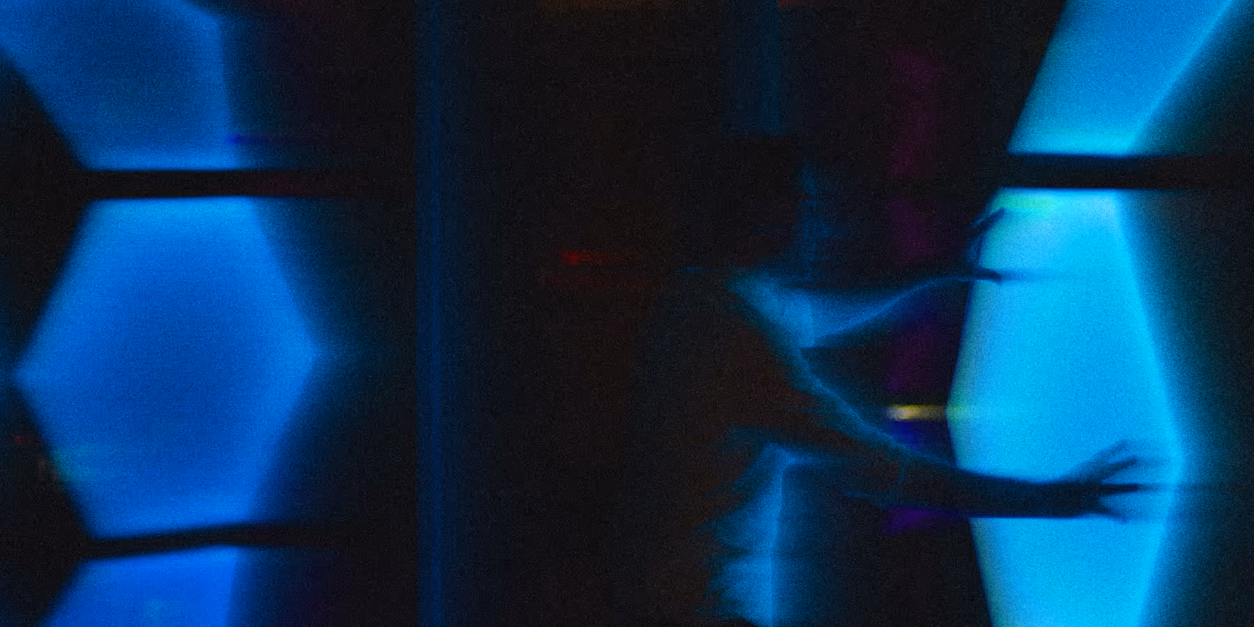 Person interacting with glowing technology surface. Spatial tracking innovation for a global consultant.