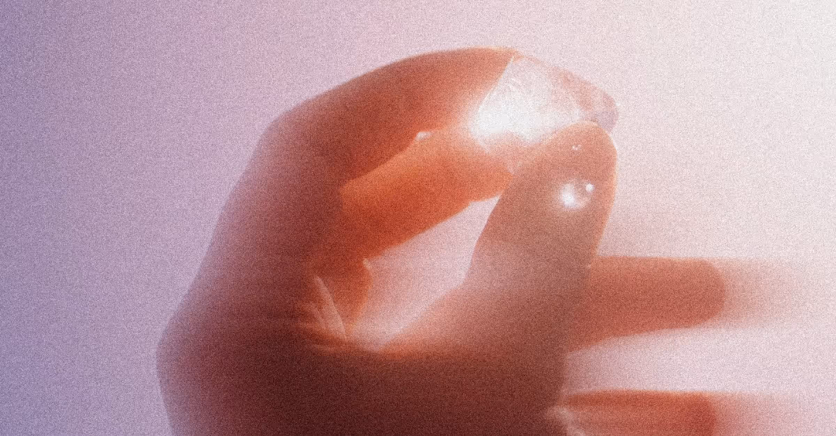 Hand holding a glowing lab sample. Marketing engine design for the Acceleration Consortium’s scientific innovations.