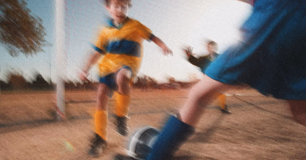 Kids playing soccer in motion blur. UX case study: improving patient awareness and consent for SickKids Hospital.