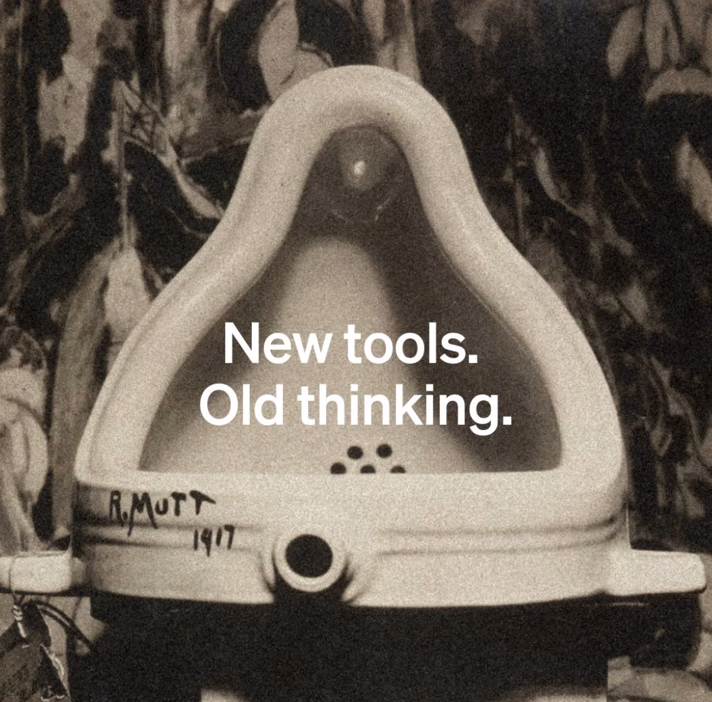 Photo of Marcelo Duchamps "Fountain" sculpture with the text "New Tools Old Thinking"