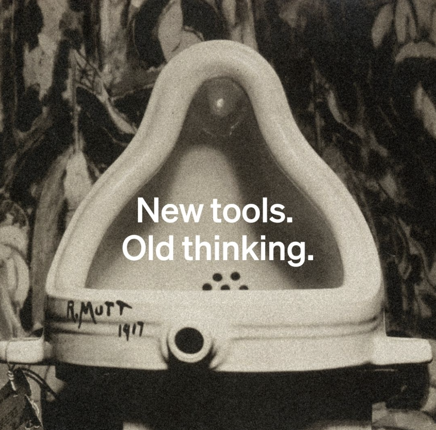 Photo of Marcelo Duchamps "Fountain" sculpture with the text "New Tools Old Thinking"