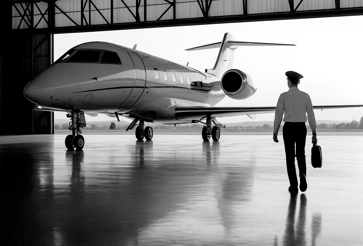Business jet in hangar with pilot walking away, representing Part 91 operations and FAA LOA readiness
