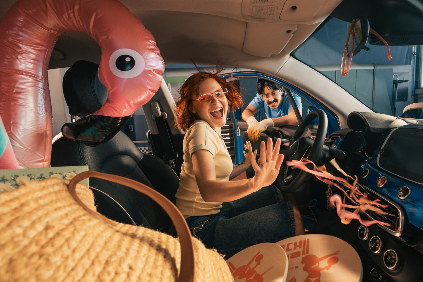 A woman dancing in her car