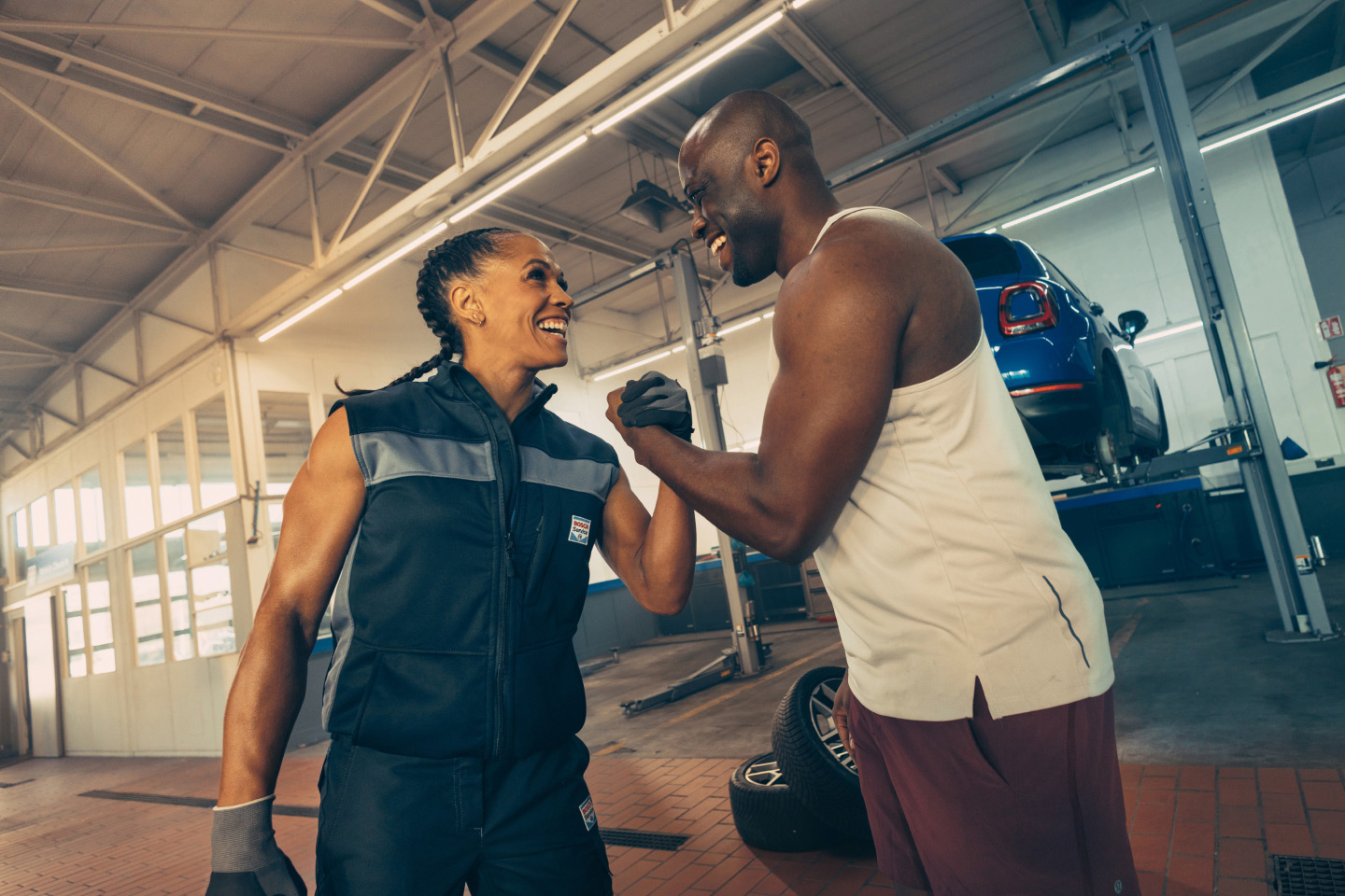 A mechanic and client shake hands