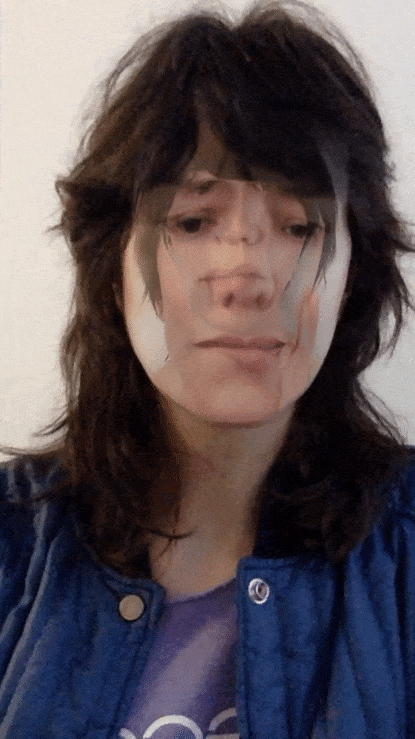 I’m turning my head and making faces into the camera. It looks like I’m wearing a mask of my own face, repeated several times in decreasing sizes.