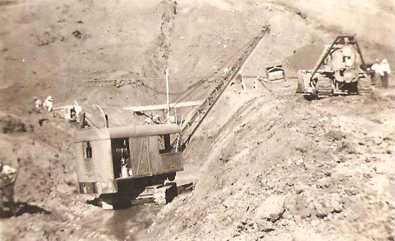 Heavy machinery at work constructing the dam at C. Ben Ross reservoir