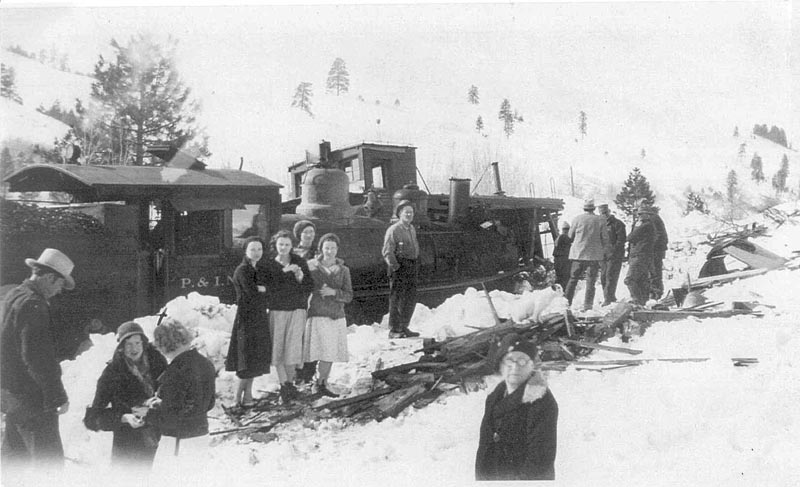 Left to right: Bill Burt at left edge; his wife, Ethel Burt; unidentified woman with back turned, Hazel Burt, Nellie Ivie, Florence Burt, Clarecie Ivie (Abbott), Jim Fisk (my grandfather); the others are unidentified.