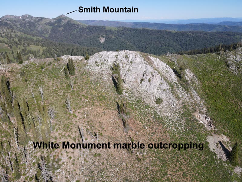 Looking east at White Monument, with Smith Mountain in the background. The white outcropping is composed of a type of crude marble, which is rather granular. Several copper claims were filed along this ridge, including the one mentioned that was filed by Allen and Lewis.
