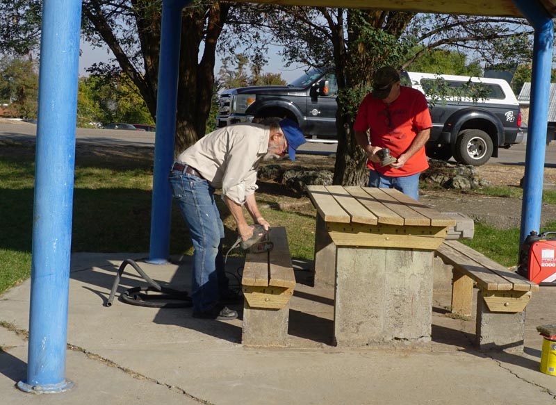 Lions George Dempsey and Scott Jones work on one of the tables at the County Park. Photo courtesy of Council Lions.