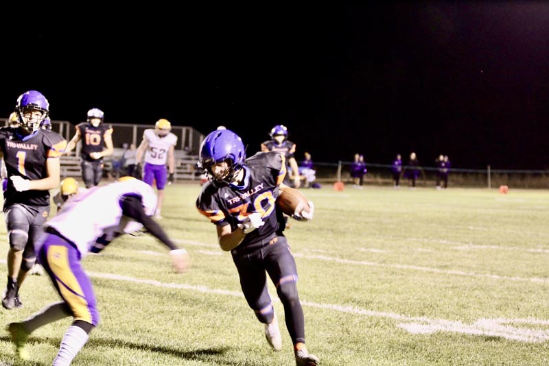 #30 Freshman Kellan Moura runs the ball against the Cascade Ramblers on October 10. The Titans won 74-0.Photo credit: Abby Ochoa
