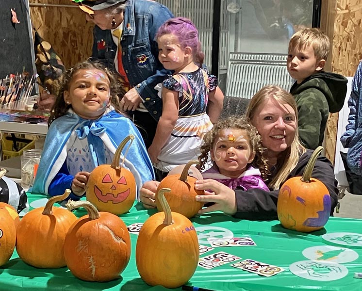 Skyler and Paisley Nolte had their faces painted at the pumpkin table. Mom Kristen was among many who brought their children to the festival. Photo credit: Bonnie Evans.