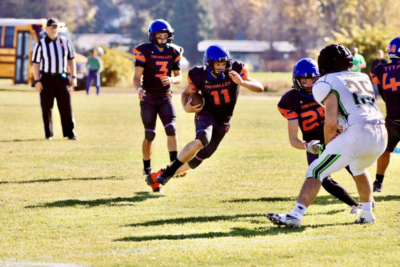 #11 Eli Noah runs the ball against Hansen on November 1.Photo Credit: Abby Ochoa.