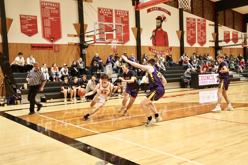 #22 Sophomore Jim Tucker drives towards the basket in Council’s game against Cascade on December 12. Council lost 36-56.Photo credit: The Record Reporter.