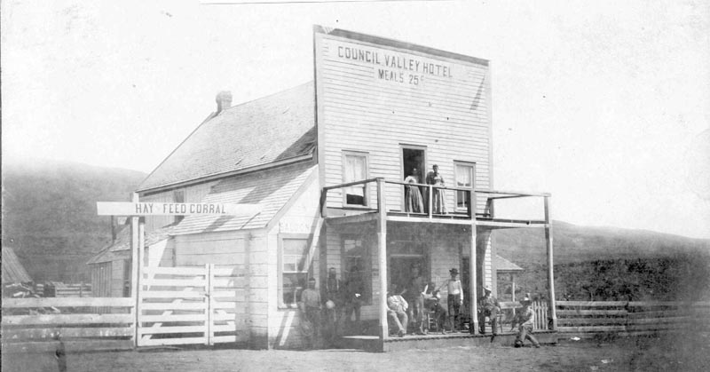 Painted across the false front of this building is ‘Council Valley Hotel - Meals 25 c.’ This is the first known photo taken in what is now Council. This was might have been the first business structure in what would become the town - built in 1891 by Milt Wilkerson and John Hancock. It stood about where the Ace Saloon is today. It’s possible that John Peters may have already established a store shortly before this, about where the M&W parking lot is today.