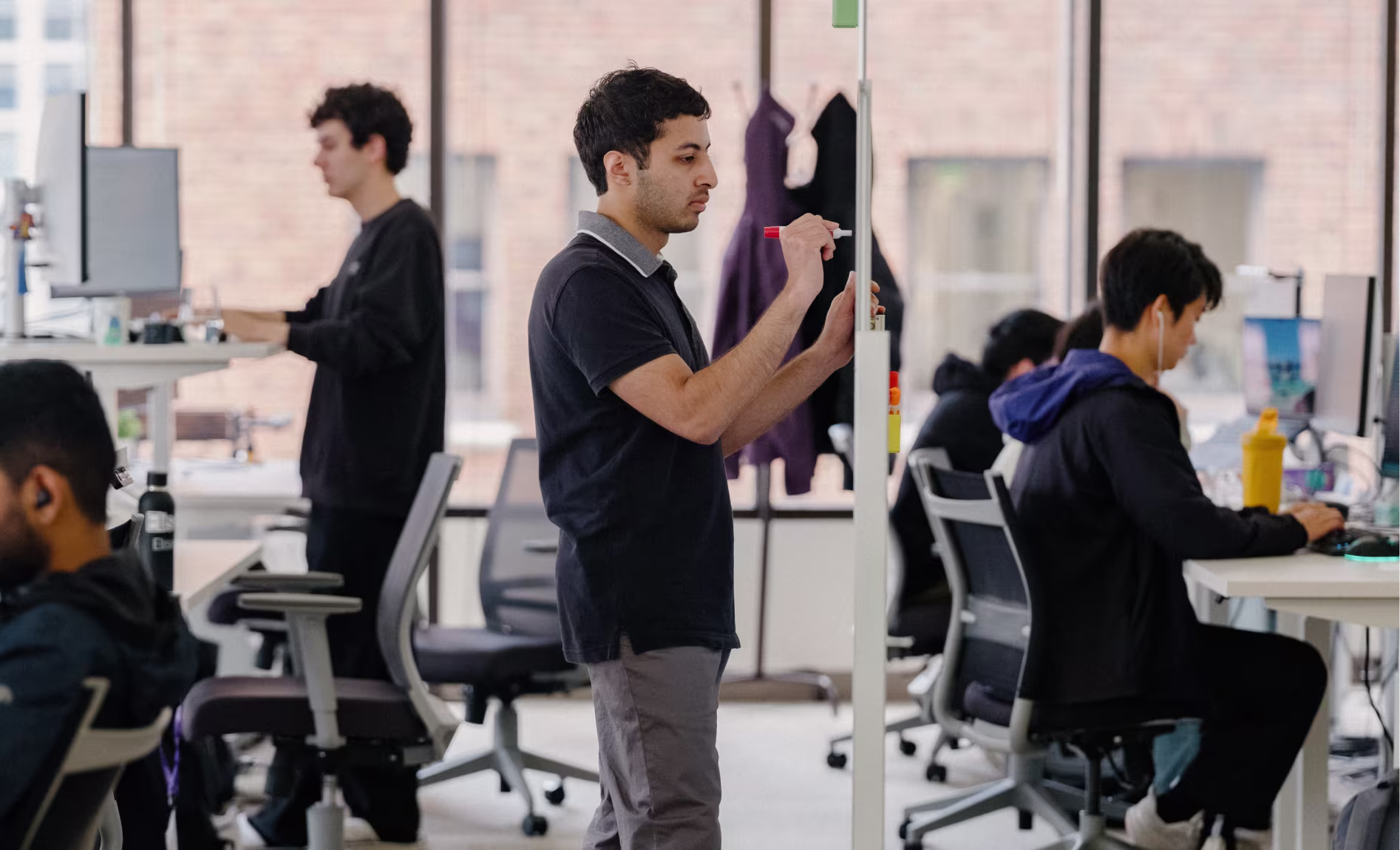 Image of employee using a white board