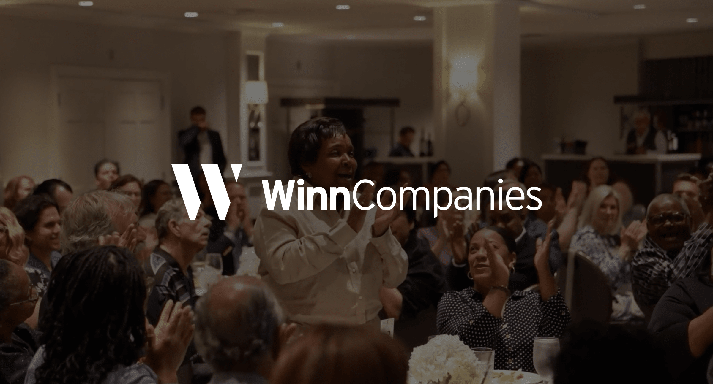 image of a group of people together with property management logo on top