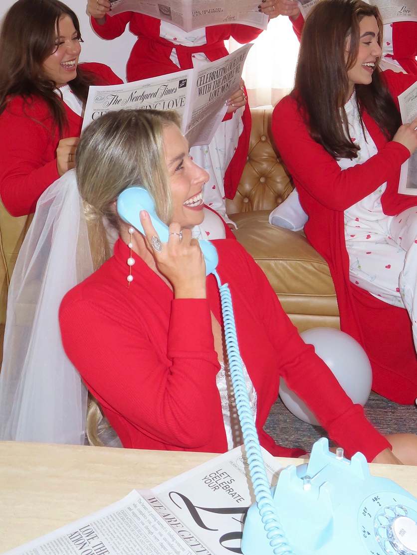Girls speaking into blue audio guerstbook