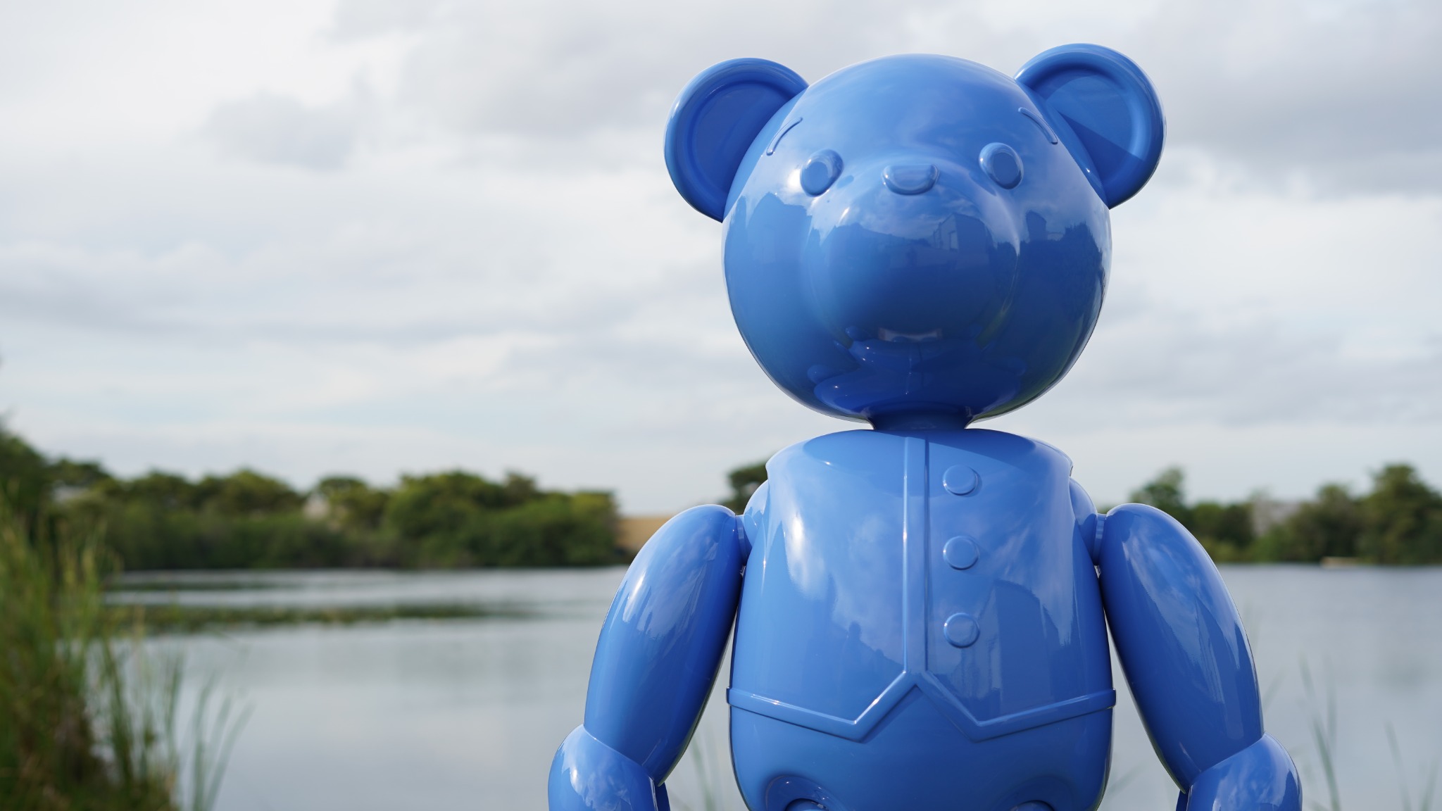 Minted Teddy by Zoran Kovacevic, a blue bear sculpture photographed outdoors