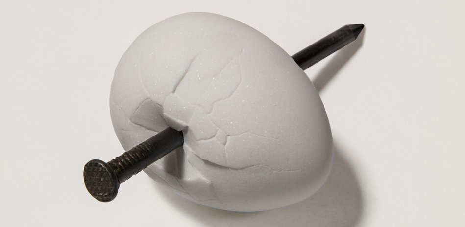 Maurizio Cattelan, First, 2025, an egg pierced by a large nail.