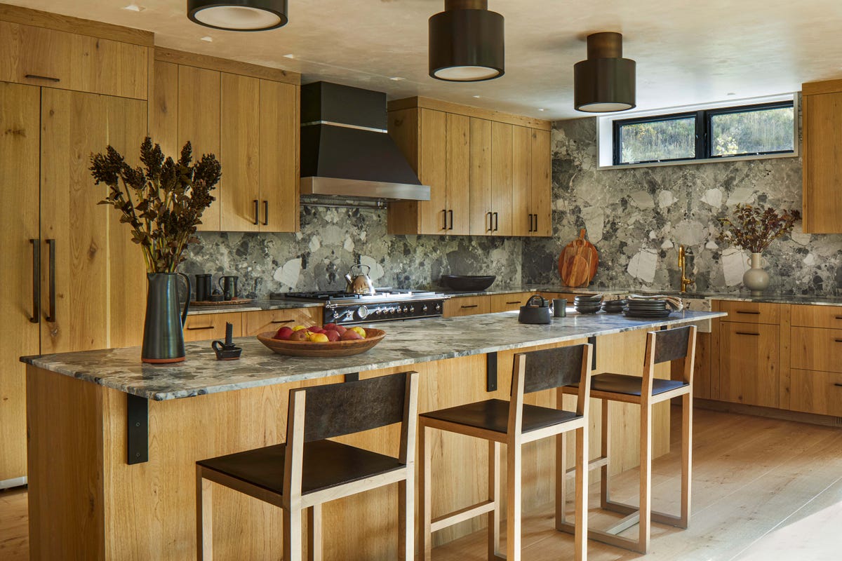 Telluride kitchen with stone surfaces, wood cabinetry and restrained mountain palette