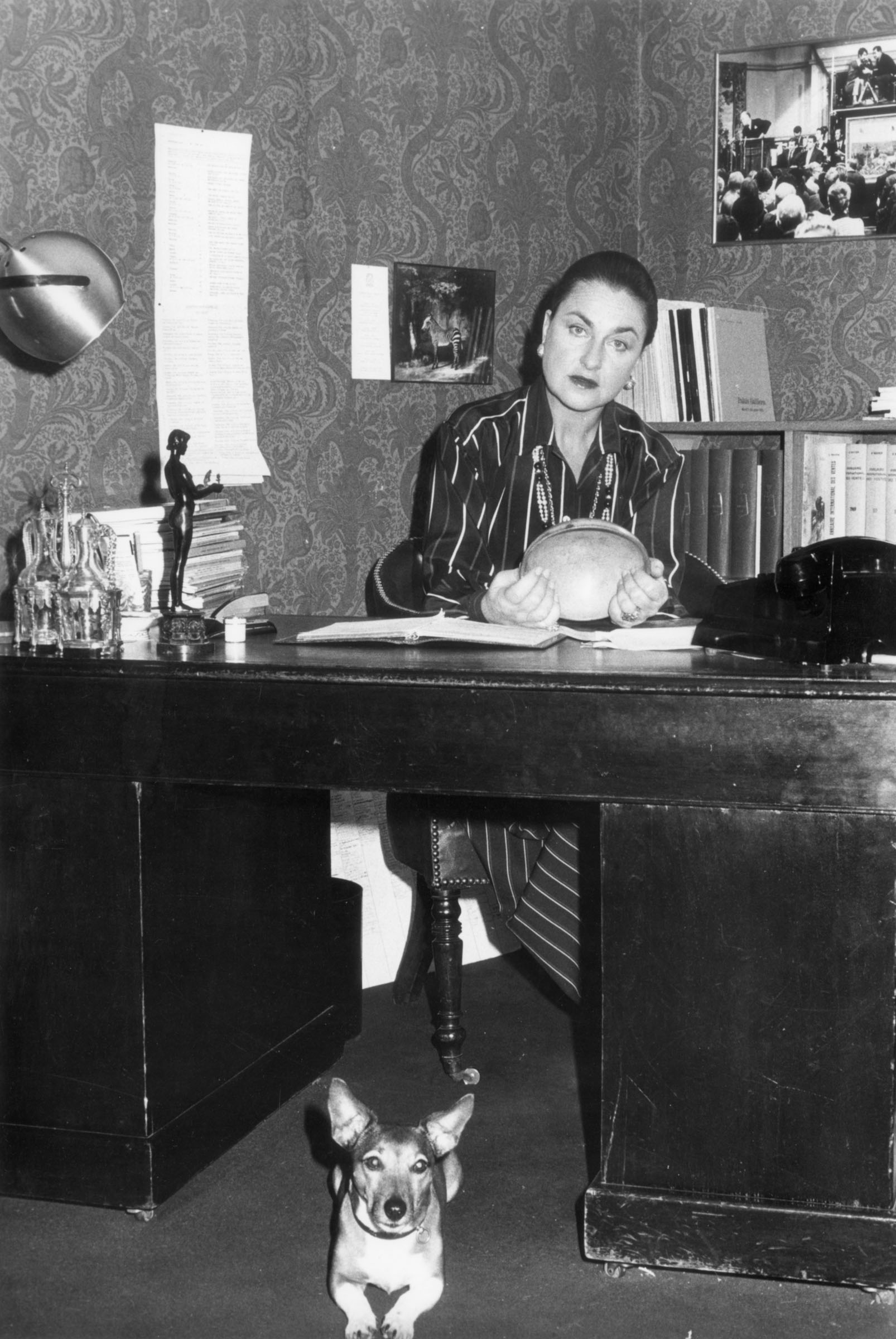 Jeanne-Marie de Broglie at her desk with her Jack Russell, Séraphine. Courtesy Christie’s.