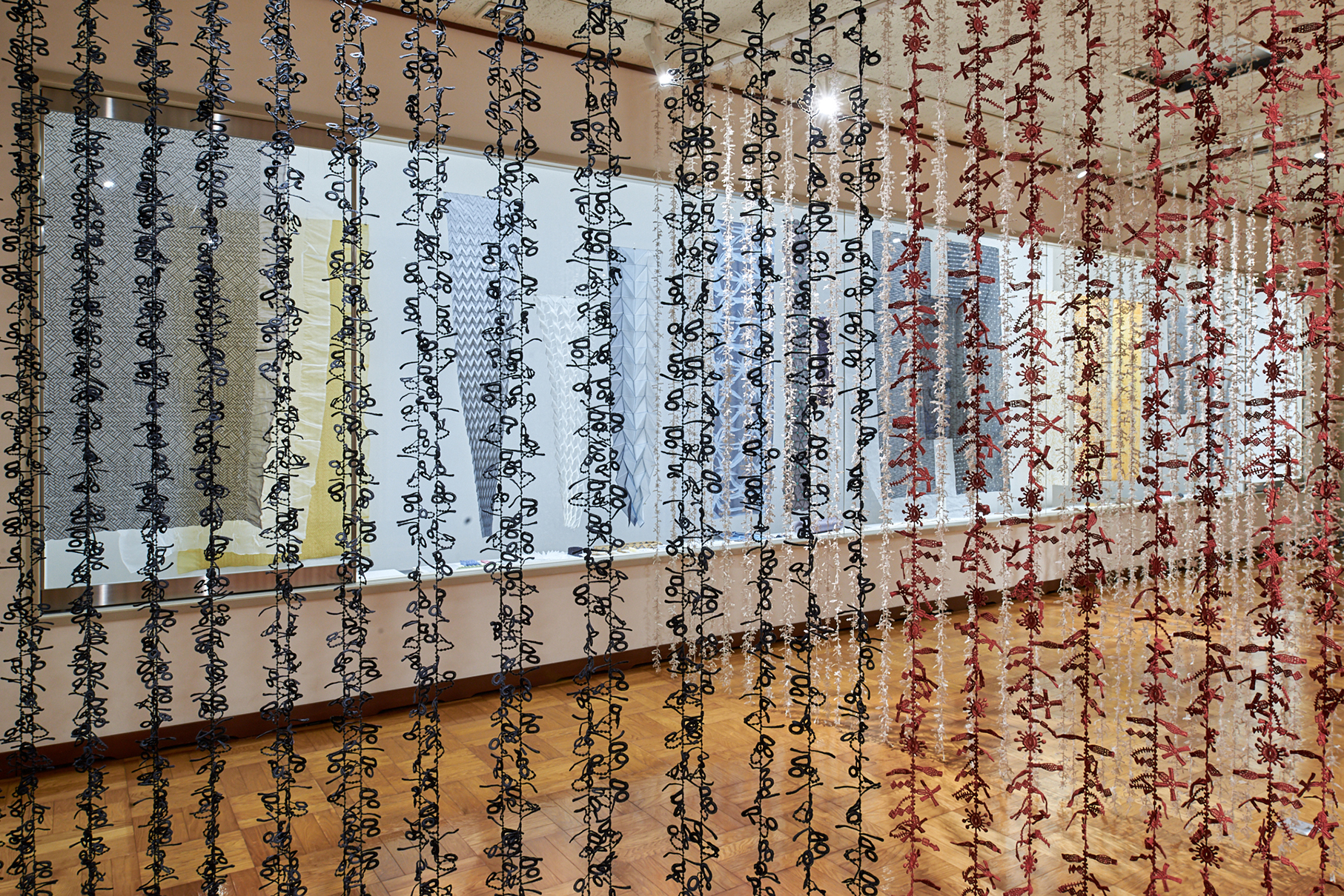 Installation view showing suspended NUNO textiles, Misato Town Alumni Museum, 2023. Photo: Masayuki Hayashi; courtesy NUNO.