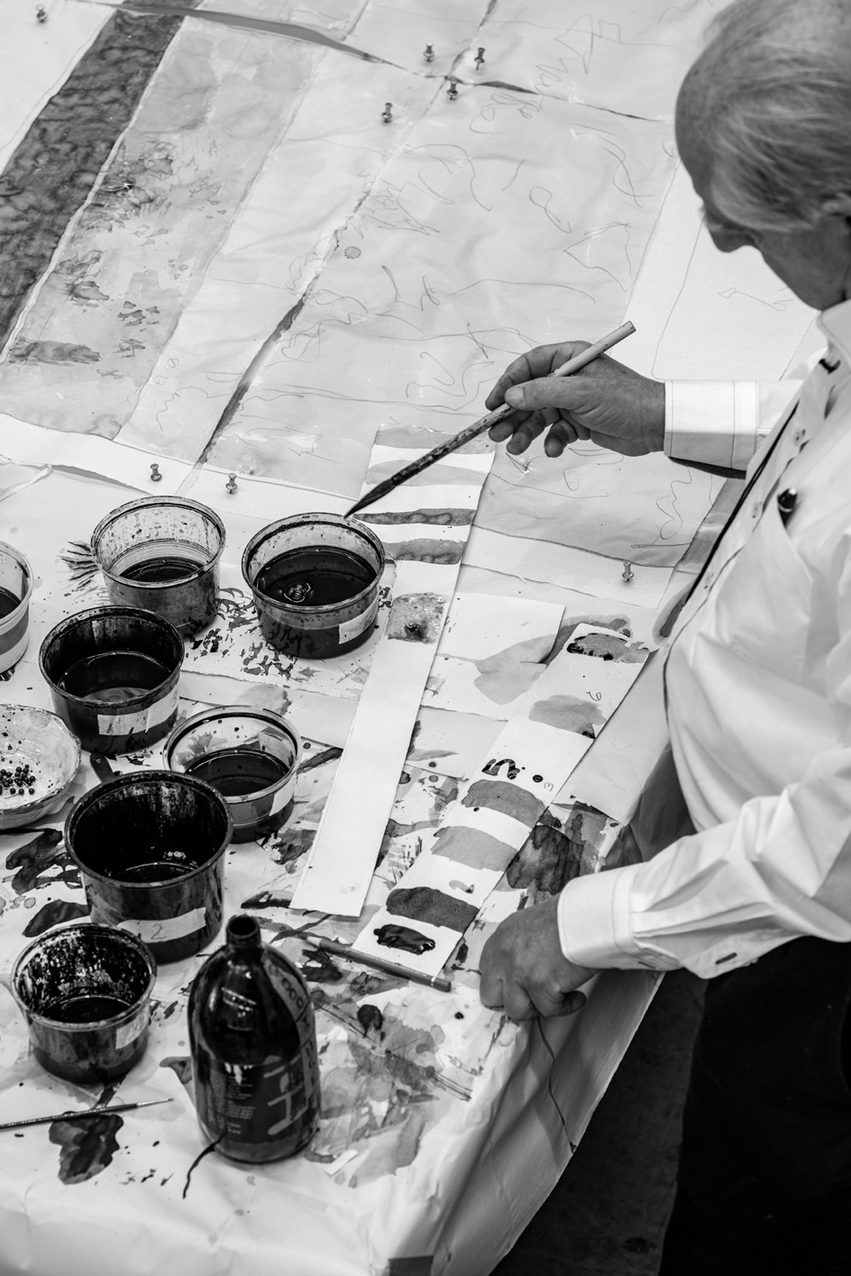 William Kentridge working with India ink on paper in his Johannesburg studio. Photograph: Nico Krijno for Wallpaper*.