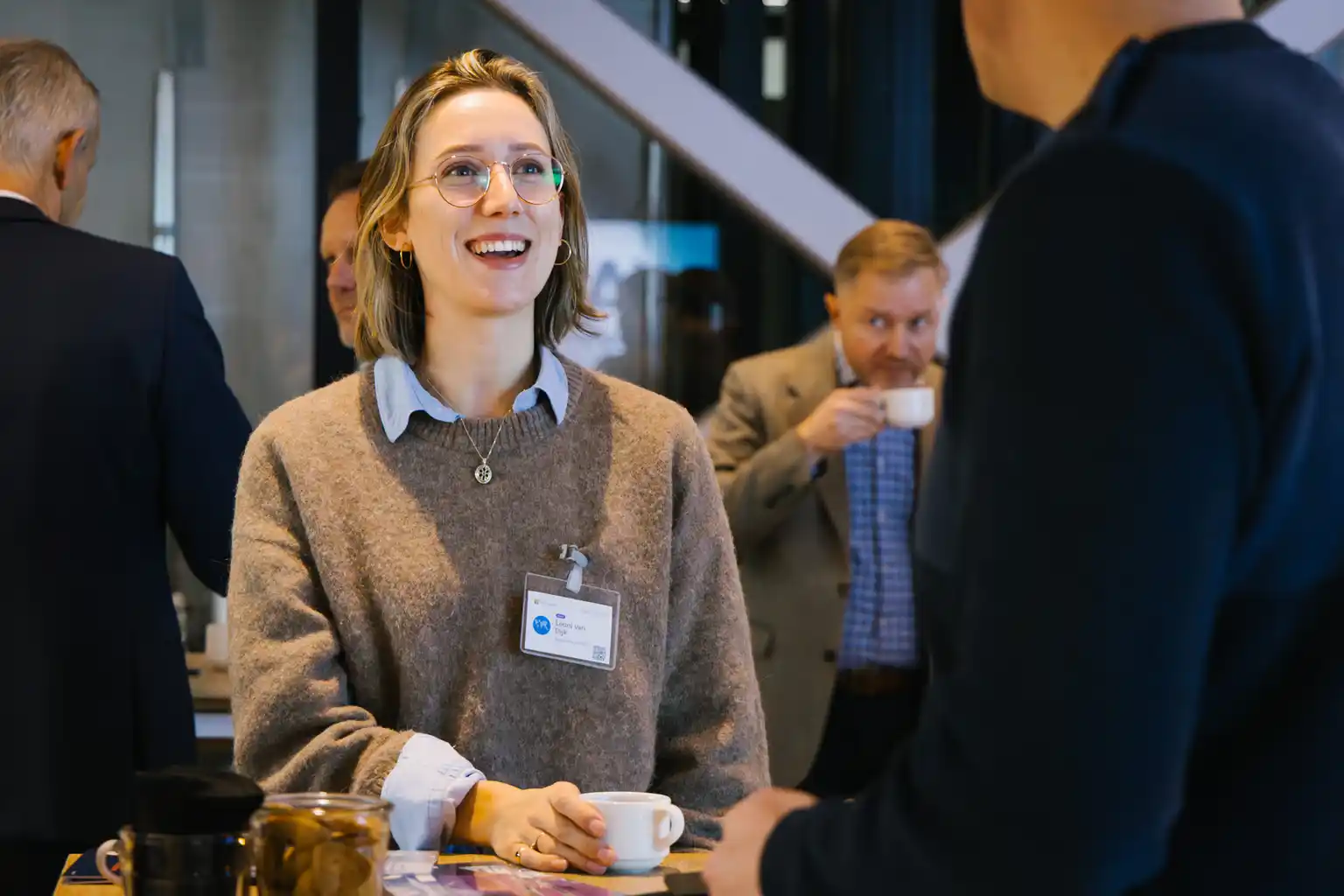 Attendee chatting with guests during event networking