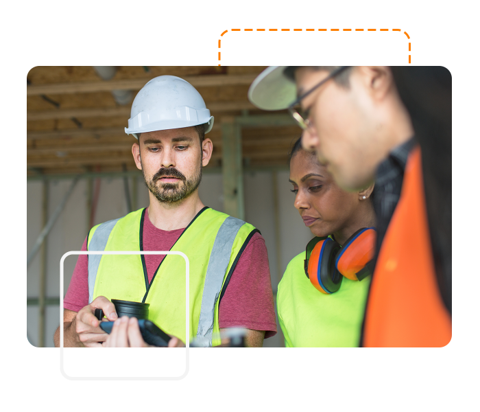 Project manager showing Site App Pro to employees
