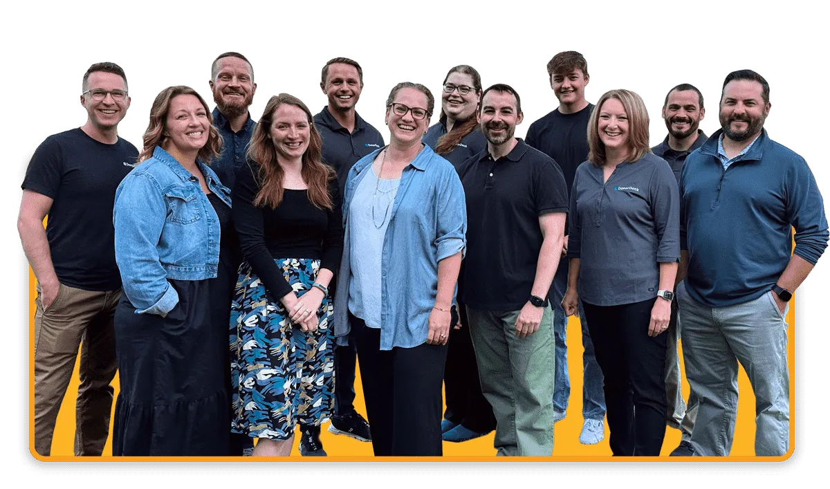 DonorDock photo of employees smiling with the joy of helping nonprofits with their donor management needs