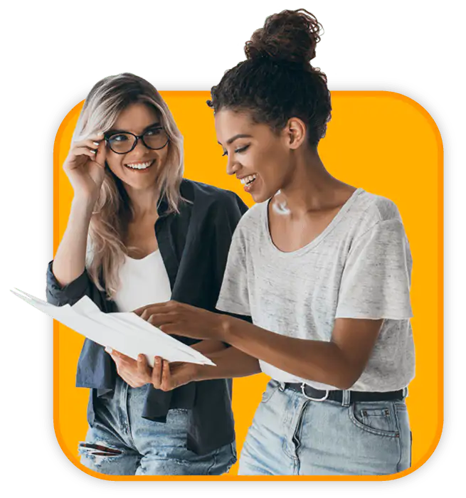 A woman with blond hair and glasses looking at a woman with dark curly hair who is holding a report from their nonprofit online giving page results