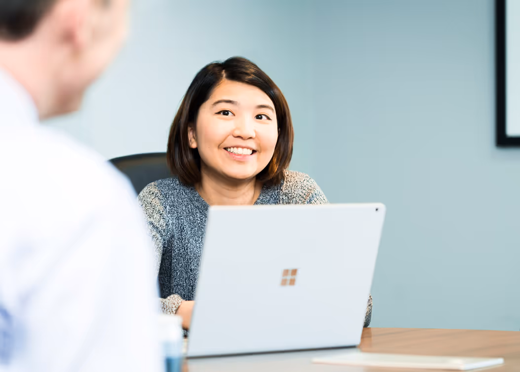 smiling woman looking at man