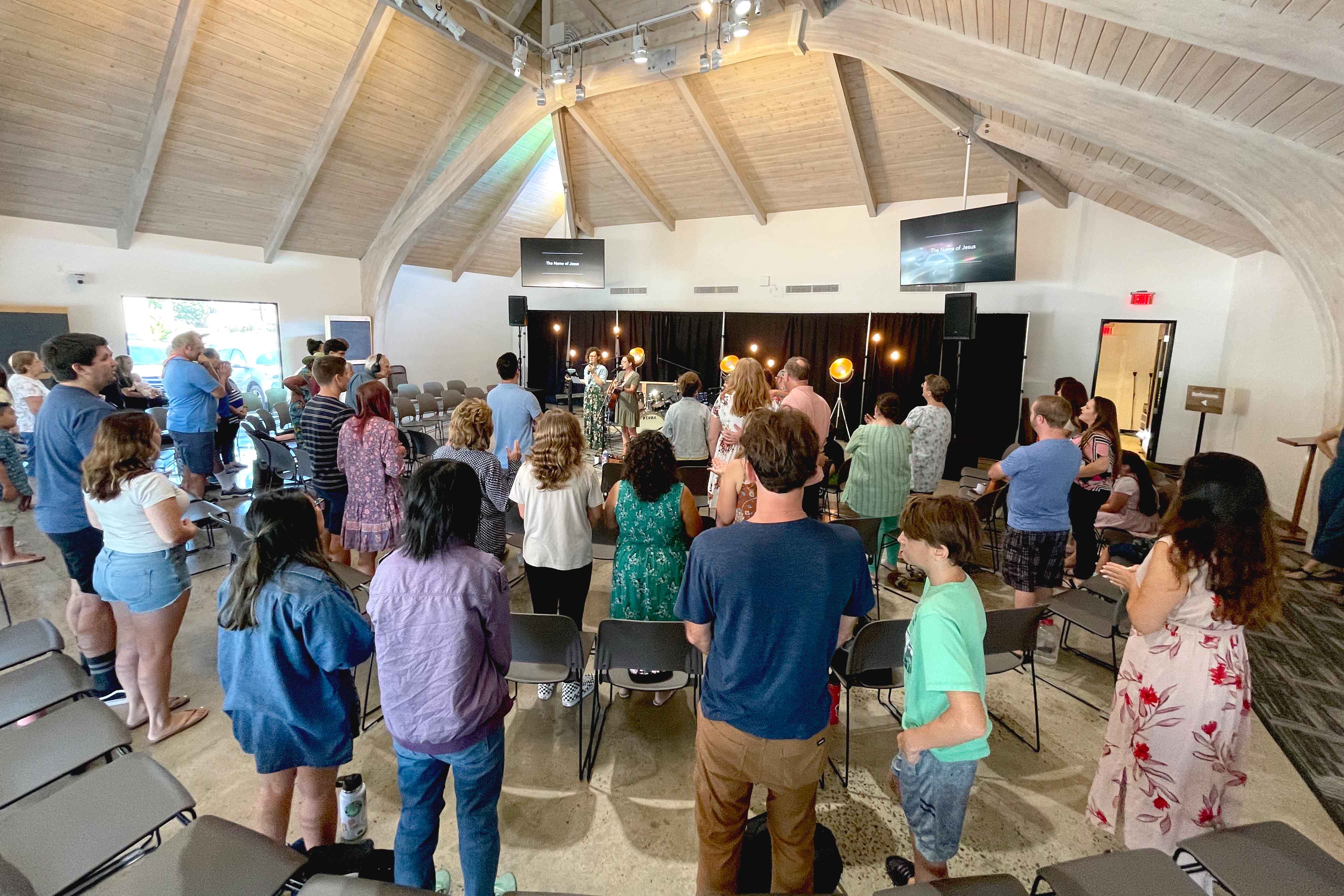 Photo of church congregation singing worship songs