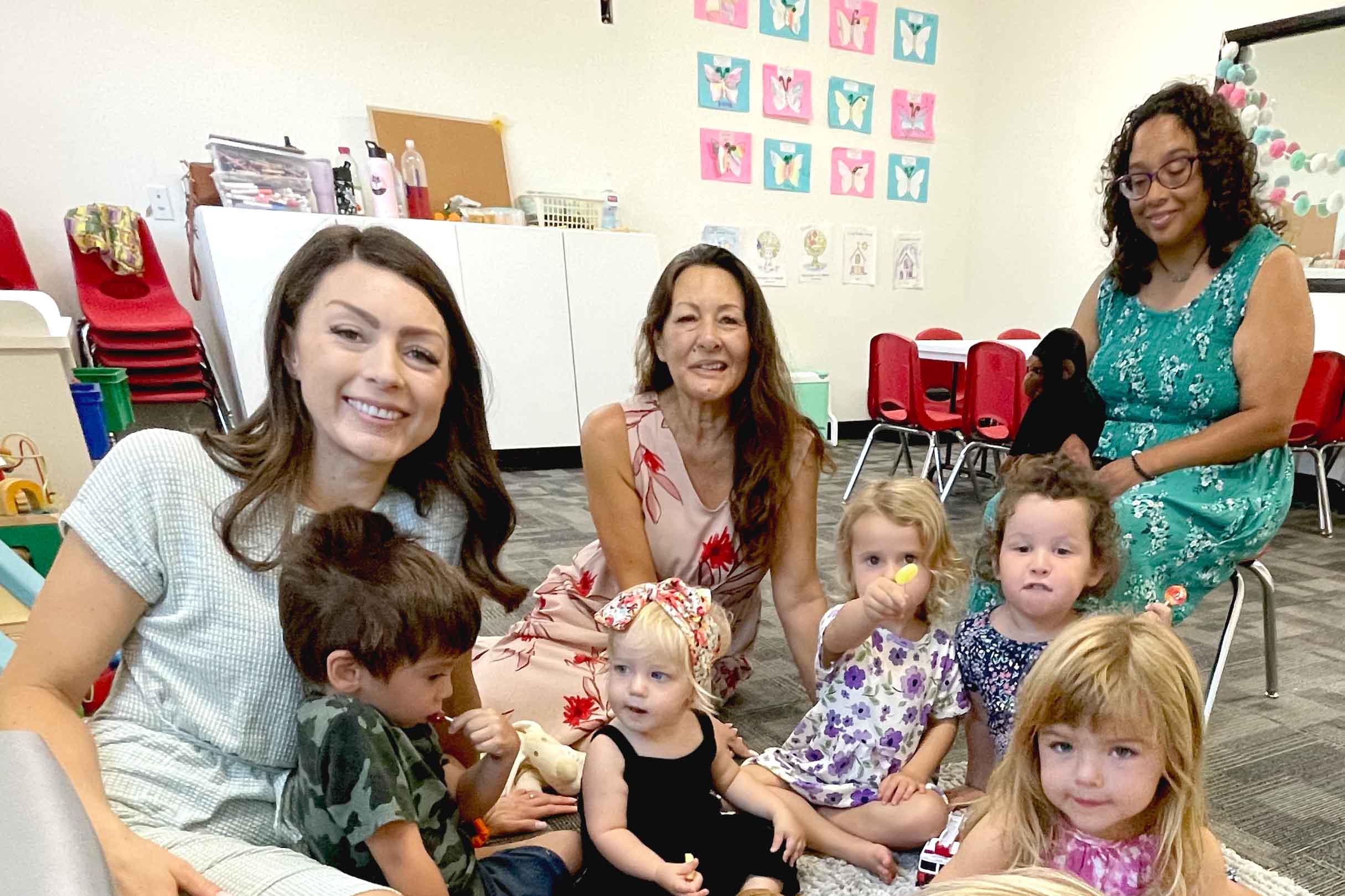 Photo of toddlers and caregivers in church  nursery