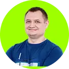 A smiling person in a blue shirt stands against a vibrant lime green circular background, conveying a cheerful and confident demeanor.