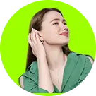 A woman with long brown hair and a serene expression, wearing a green top, touches her ear. Bright green background, creating a fresh and lively tone.