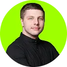 A person with short hair in a black shirt smiles subtly against a bright green circular background. The tone is calm and confident.