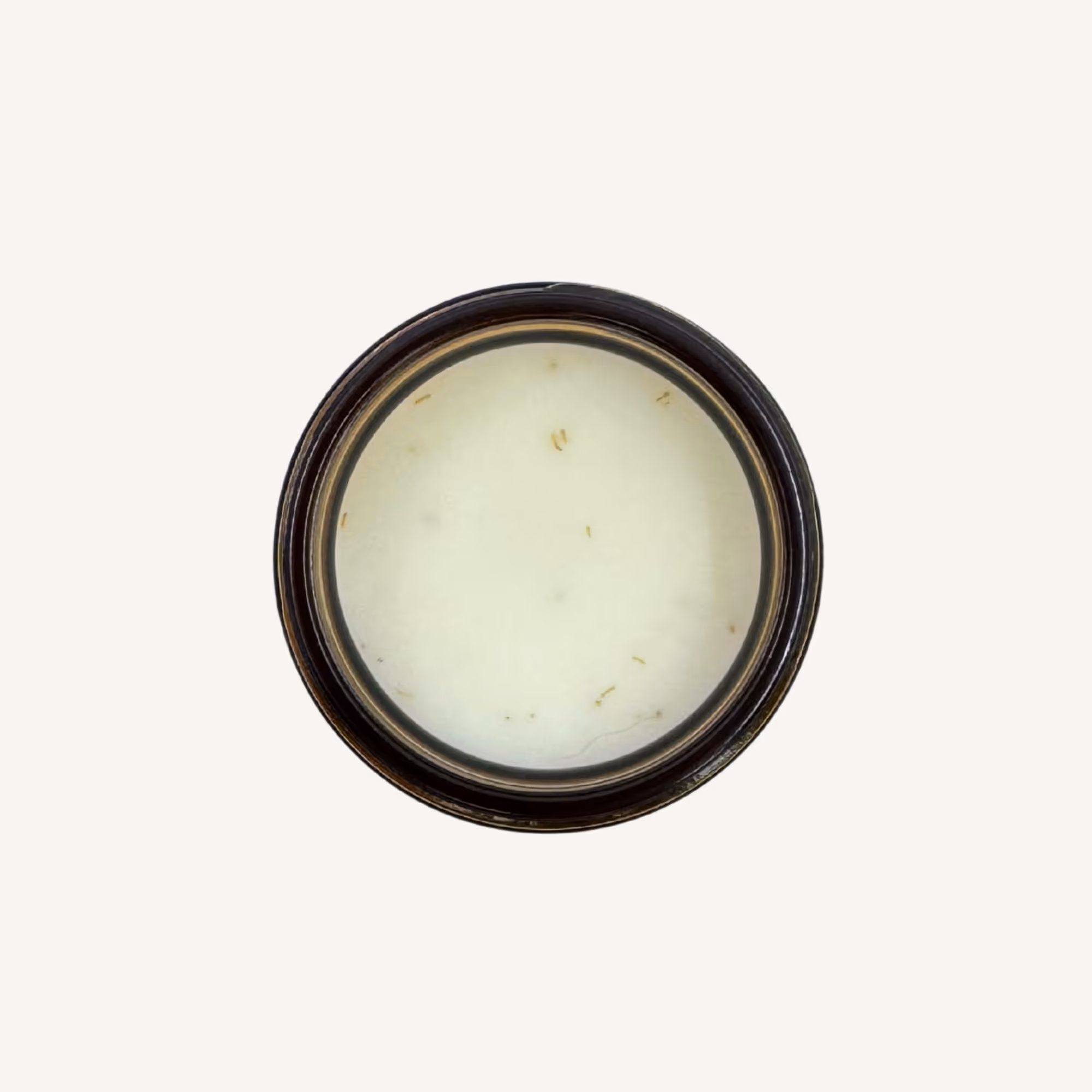 Top-down view of All Tree Roots Healer Salve in a 2 oz amber glass jar, a natural herbal salve made with calendula, chamomile, and beeswax for dry, irritated, and compromised skin.