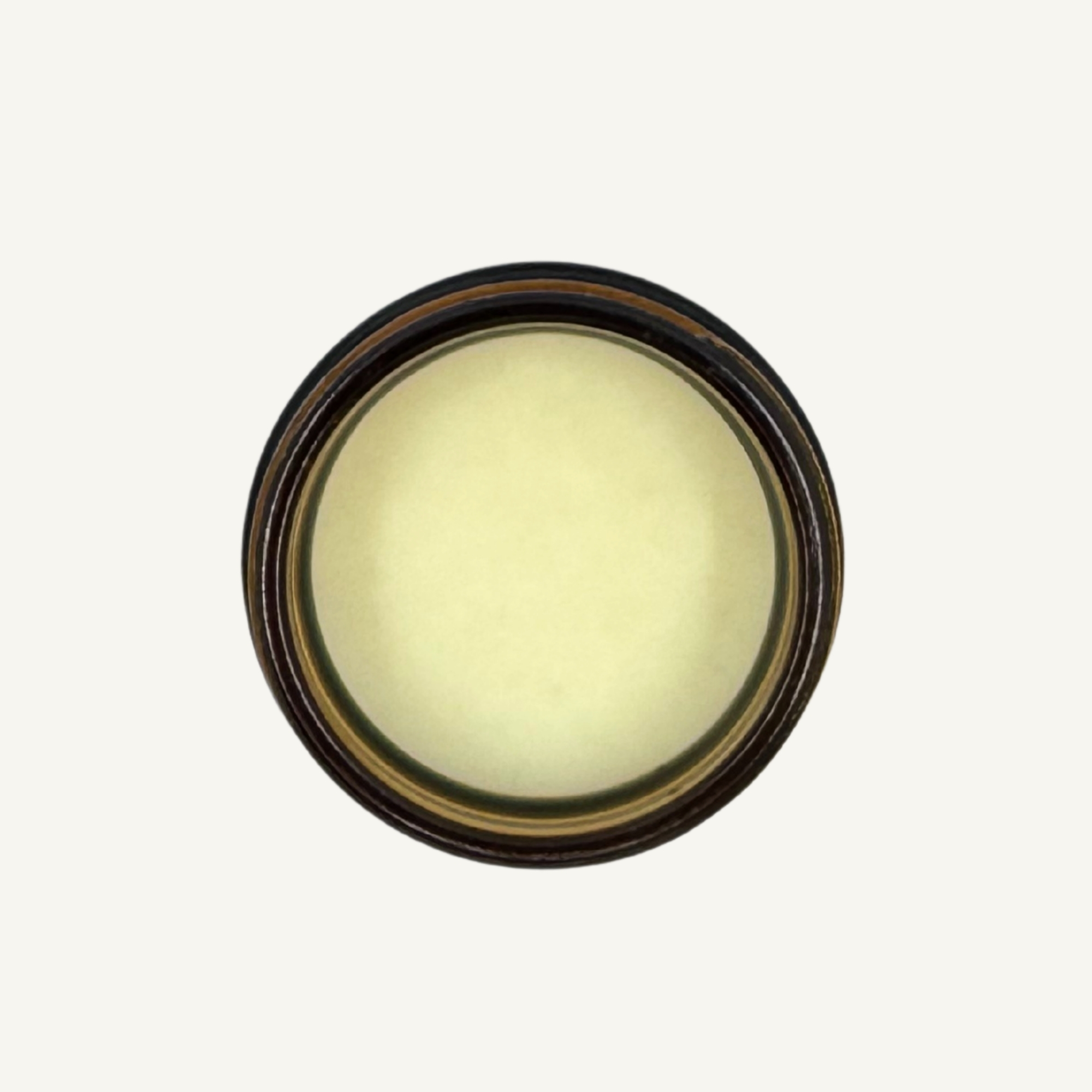 Top-down view of All Tree Roots Yarrow Salve in a 2 oz amber glass jar, an organic herbal salve for irritated and sensitive skin