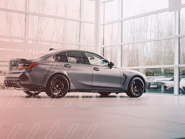 BMW M3 inside a car dealership showroom