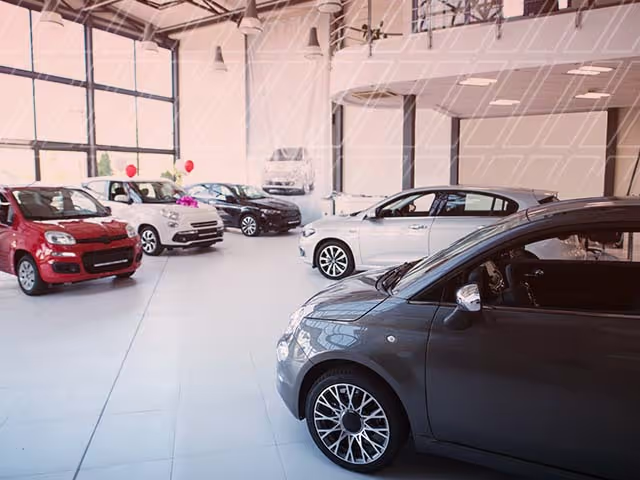 Used car inventory inside a dealership showroom