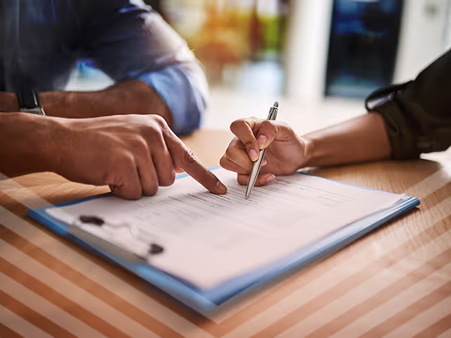 Car dealer reviewing a bonded car title
