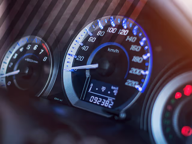 A used car odometer with over 90,000 miles